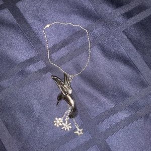 Hummingbird w/ 2 flowers, a star dangling beneath